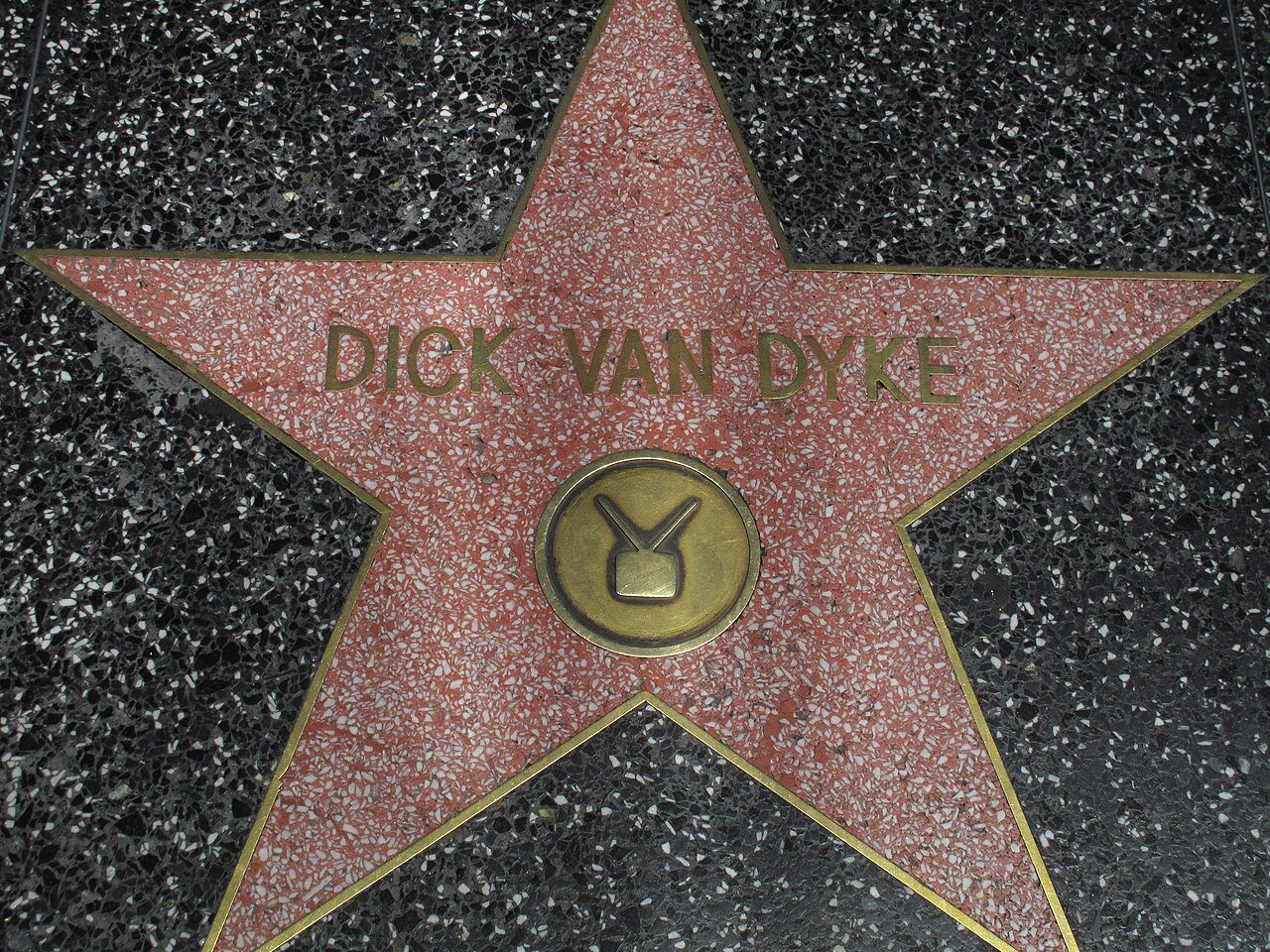 Dick Van Dyke's star on the Hollywood Walk of Fame, a pink terrazzo star with a gold television emblem