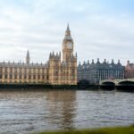 Houses of Parliament UK and Elizabeth Tower beside the River Thames in London